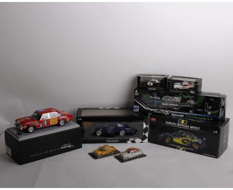 A collection of racing themed cars to include a Sun Star 1:18 scale Subaru Impreza WRC07, #7 Wales Rally GB 2007 (1/999pcs), 