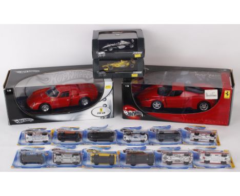  Sixteen Hot Wheels model cars, to include a 1:18 scale Ferrari 250 LM, a 1:18 scale Enzo Ferrari, 1:43 scale Jordan EJ10 and