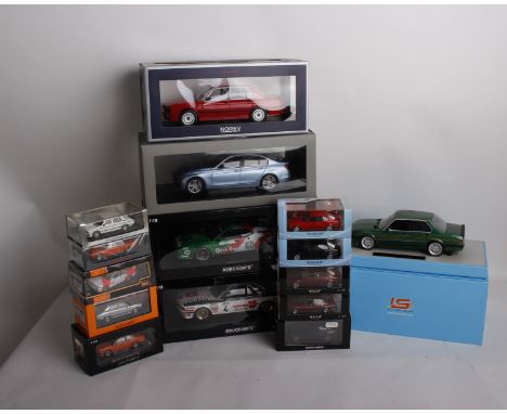 A collection of fifteen BMW model cars varying in scale and model manufacturer. To include a 1:18 scale IS Collectibles BMW A