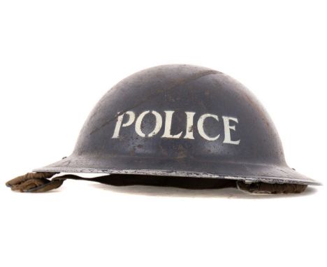 POLICE BRODIE HELMET WWII-PERIOD, BRITISH with POLICE decal, stamped G12 to inner rim, with webbing and chin strap, along wit