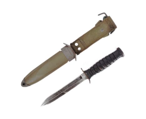 A WWII Second World War US United States M3 fighting knife as issued to the Airborne Troops. Grooved leather handle and a ste