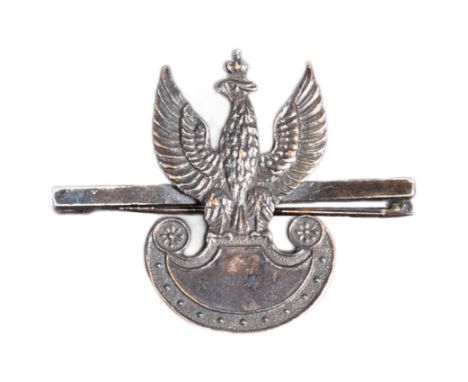 A WWII Second World War Free Polish Army sweetheart brooch / tie pin depicting the crowned winged eagle resting on an Amazon 