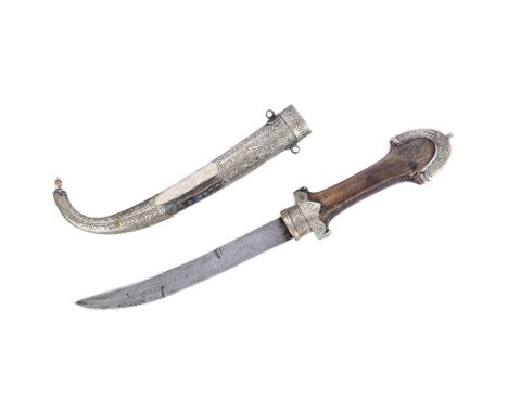 An early 20th Century Middle Eastern / Syrian Jambiya dagger. Capped pommel with ball finial, wooden grip with white metal mo
