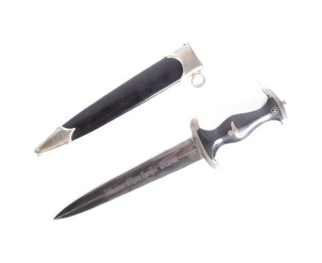 A WWII Second World War Third Reich Nazi German Waffen SS dagger with Rohm dedication. The shaped grip inlaid with enamel SS 