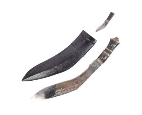 A vintage Nepalese / Gurkha Regiment Kukri knife dagger. Capped pommel in the form of a Lions head, carved horn grip inlaid w