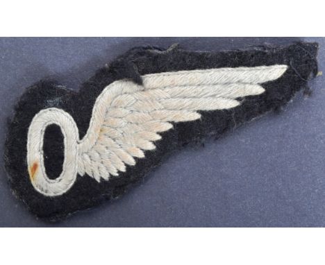 A WWII Second World War British RAF Royal Air Force Observers patch. A white stylized wing attached to the right side of a le