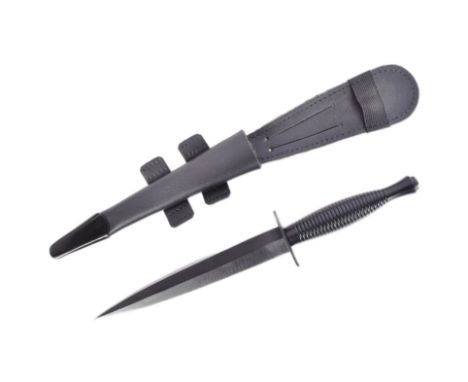 An original current issue FS Fairbairn Sykes British commando knife dagger. The knife having a nut to the pommel, ribbed hand