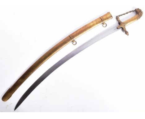A 19th century Indian Shamshir single edged sword with a brass handle and scabbard. The pommel featuring a lions head, and th
