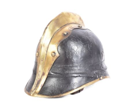 A WWI First World War Imperial German / Prussian Fireman's helmet of brass and leather construction with a&nbsp;split pin ' c