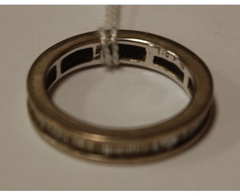 An 18ct white gold and baguette cut diamond eternity ring Condition Report / Extra Information Has British hallmark and Londo