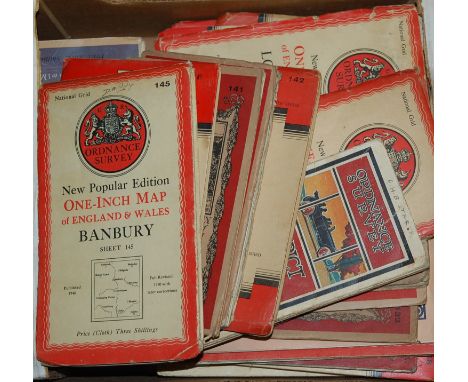 A box of assorted mid-20th century Ordnance Survey maps