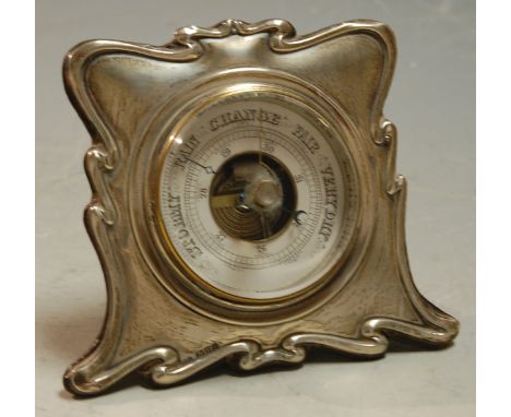 An Art Nouveau silver cased barometer of easel form Condition Report / Extra Information Several small pin dents to outer edg