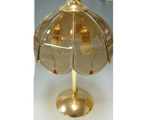 A large lacquered brass table lamp with smoked glass shade, together with matching ceiling light fitting (2) 