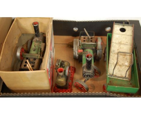 A boxed Mamod traction engine, together with one other stationary steam engine and cart