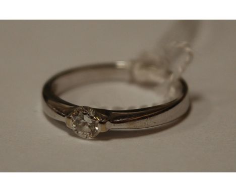 A contemporary white metal ladies diamond solitaire ring 
