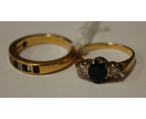 A ladies yellow gold sapphire and diamond set dress ring; and one other 18ct gold baguette cut ruby and diamond set half eter