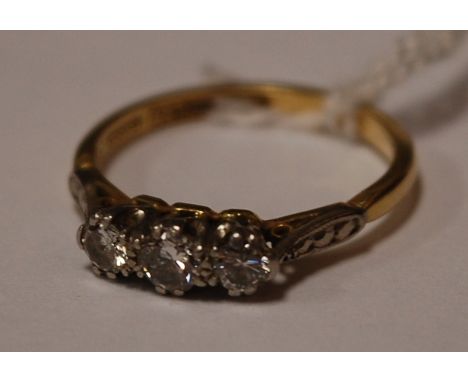 An 18ct yellow gold and platinum diamond three stone ring Condition Report / Extra Information Weight 2.8g.
