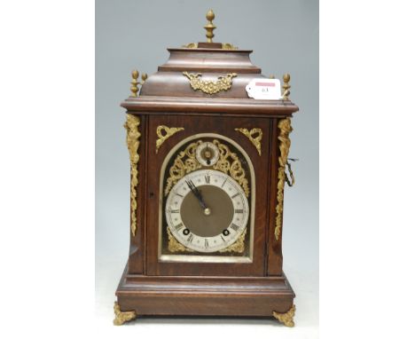 A circa 1900 Winterhalder & Hofmeier oak and beech cased bracket clock, having gilt metal mounts, the matt dial with silvered
