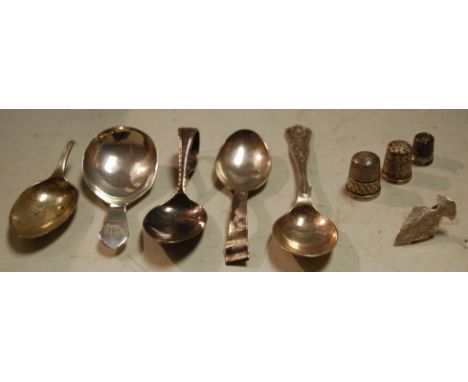 A George III silver caddy spoon together with various other silver spoons and thimble etc