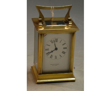 An early 20th century lacquered brass cased carriage clock, the enamel dial with Roman numerals  signed Sharman D Neill of Be