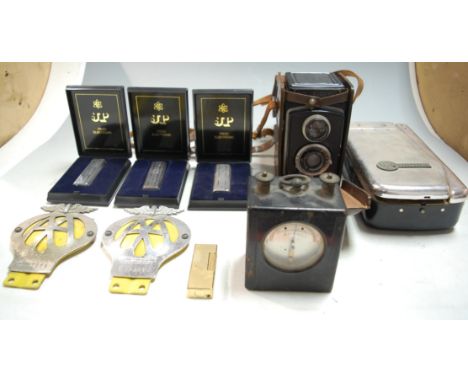 A small collection of miscellaneous items to include a cased Rolleicord camera, two AA car badges, and a Dunhill, lighter etc
