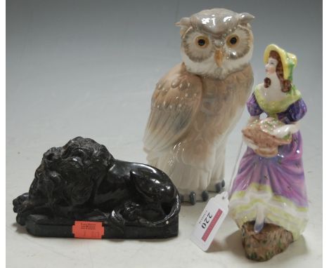 A Coalport figurine of Jennifer Jane; together with a Nao figure of an owl; and and carved polished stone figure of a recumbe