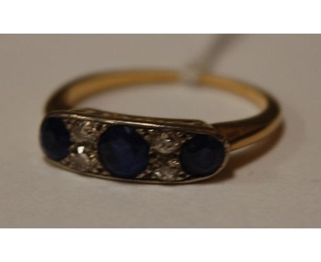 A yellow gold and platinum sapphire and diamond set dress ring 