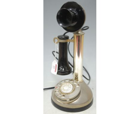 An early 20th century chrome stick telephone 