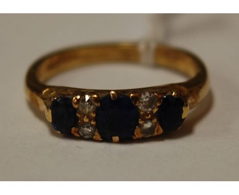 A ladies 18ct gold sapphire and diamond set dress ring