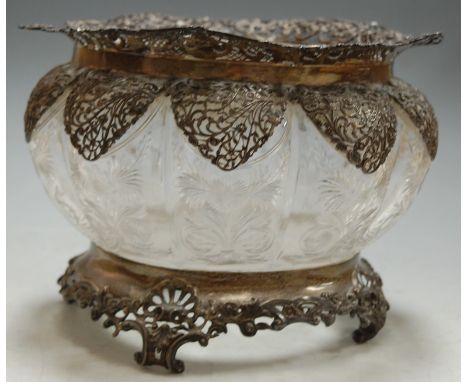 An Edwardian cut glass and silver mounted bowl, of good size and lobed circular form, each panel engraved with leaves and flo