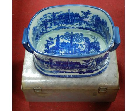 A large modern blue & white twin handled  foot bath together with a small tin trunk