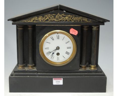 An early 20th century black slate mantel clock of architectural form, having white enamel dial with Roman numerals 