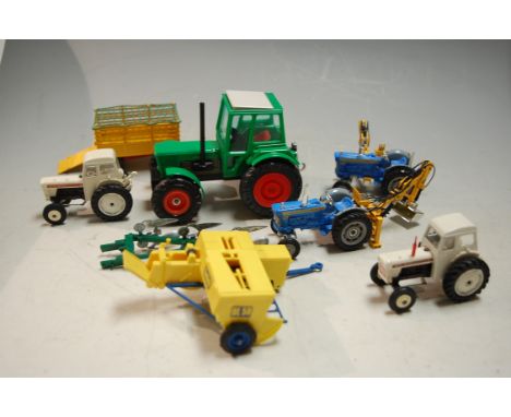 A box of assorted loose playworn diecast and plastic toy vehicles to include Corgi Toys Beast Carrier, Ford tractor etc