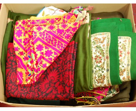 A box of assorted modern textiles to include embroidered table cloth etc