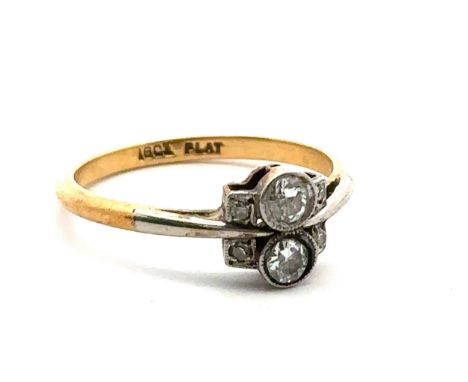 An art deco diamond ring stamped 18ct and plat. Size N. Estimated total diamond weight approx 0.2ct. Weight 2.53g. 