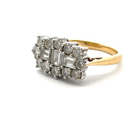 An 18ct and diamond cluster ring - set with three baguette cut diamonds surrounded by 12 round brilliant cut diamonds. Estima