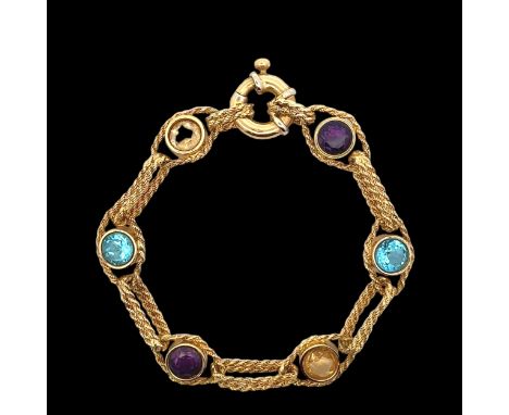 A multi-gem bracelet gold bracelet stamped 512AR 750. The bracelet comprising of collet set amethysts, lemon quartz and  blue