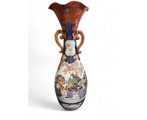 Large Japanese twin handled floor vase. Likely 19th Century. Richly decorated with Samurai warriors, horses and tree blossoms