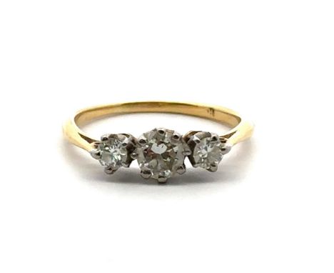 A three stone diamond ring, size L in unmarked yellow metal, tested as 18ct using XRF. Central diamond estimated 0.38ct, clar