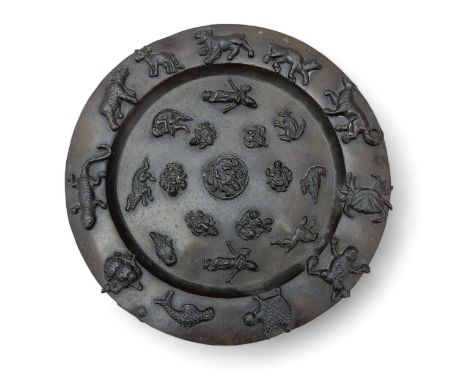 An Asian, likely Indian, copper alloy salver raised on three legs, with applied animals around the ring and and with deities 