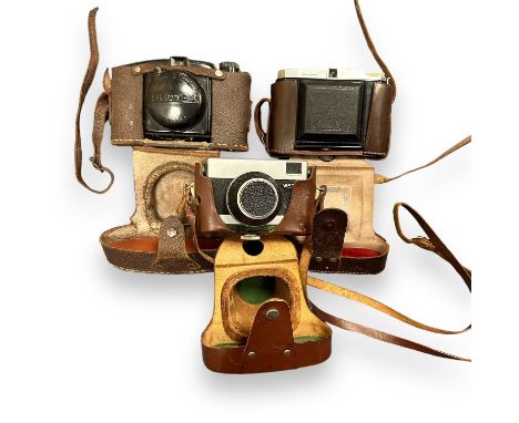 3 Vintage Film Cameras. A Dacora folding camera with Vario shutter. A Carl Zeiss Werra 1 camera. A Photax Bakelite Boyer Seri