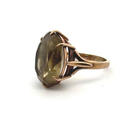 A prasiolite quartz 9ct gold ring, size J. Quartz approx 18 x 12mm with minor nibbles on facet edges and large chip to girdle
