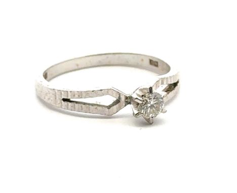 An 18ct white gold single stone ring, size M. Estimated diamond weight 0.15ct. Weight 3.1g