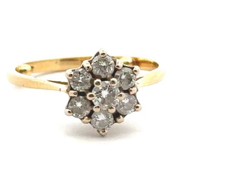 A diamond 'flower' ring in yellow gold mount, stamped 18ct. Size approx M with sizing beads. Estimated diamond weight 0.68ct.