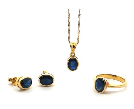 A sapphire and 18ct gold necklace, earrings and ring set. Pendant set with sapphire 8mm x 6mm, stamped 18k, suspended on a 16