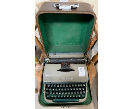 Vintage Remington 'Quiet Riter' typewriter in case. Viewing/collection at West Woodlands BA11 5ES. Payment at Standerwick BA1