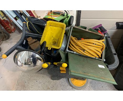Plastic garden wheelbarrow containing galvanized wire, shears, saws &amp; other tools.  Viewing/collection at West Woodlands 