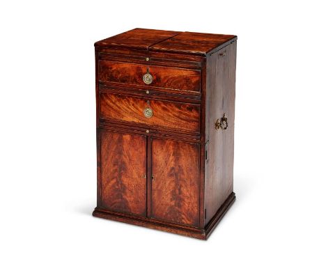 A George III mahogany 'croft' or gentleman's travelling writing cabinet
The hinged folding rectangular top above a frieze dra