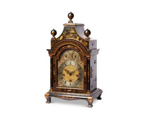 A late 19th century black japanned Chinoiserie quarter chiming mantel clock
Heightened with gilt chinoiseries, the pagoda top