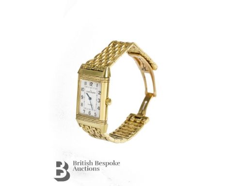 Jaeger-le-Coultre gentleman's 18ct gold reverso wrist watch and bracelet.  The wrist watch having a white and silvered face w